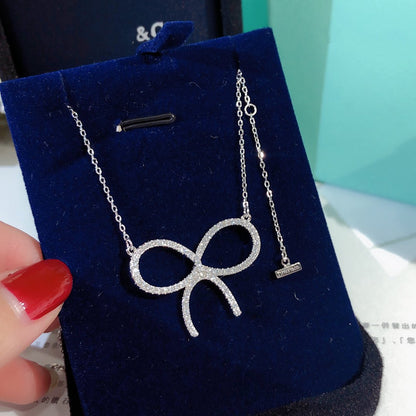 [Stellar jewels]CLAW SET RHODIUM PLATED BOW NECKLACE