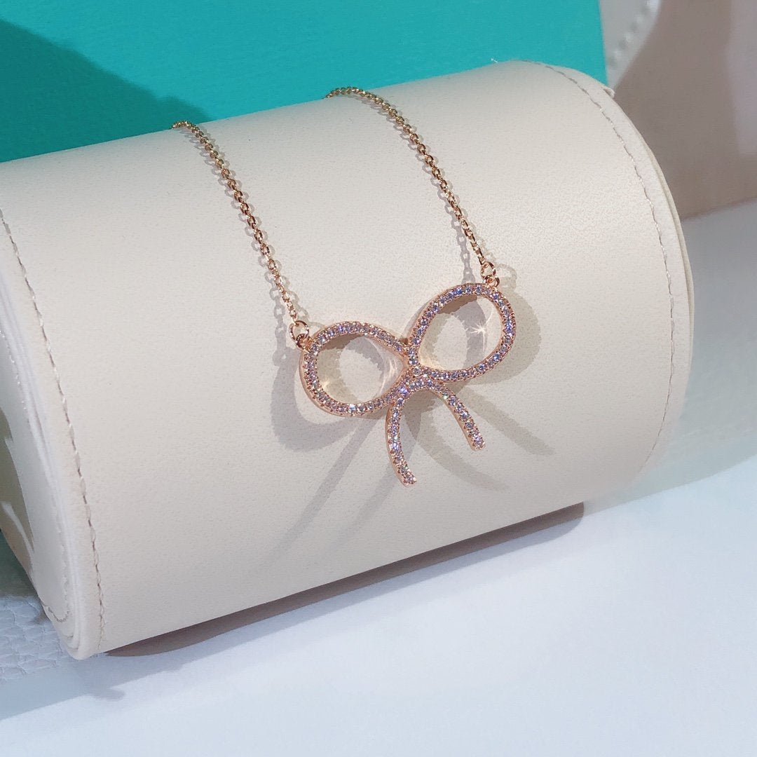 [Stellar jewels]CLAW SET RHODIUM PLATED BOW NECKLACE