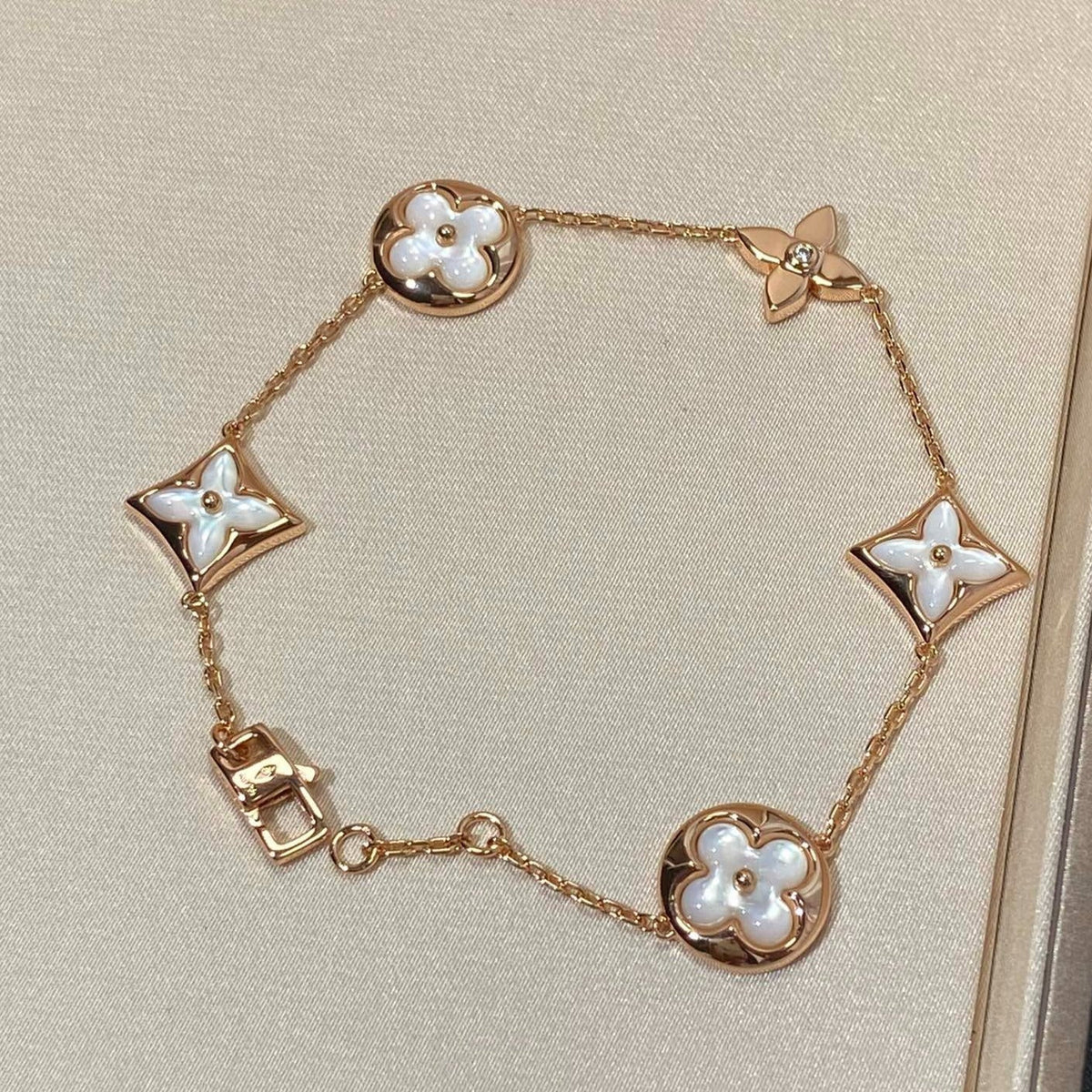 [Stellar Jewelry]STAR AND SUN 5 MOTIF MOP PINK GOLD BRACELET
